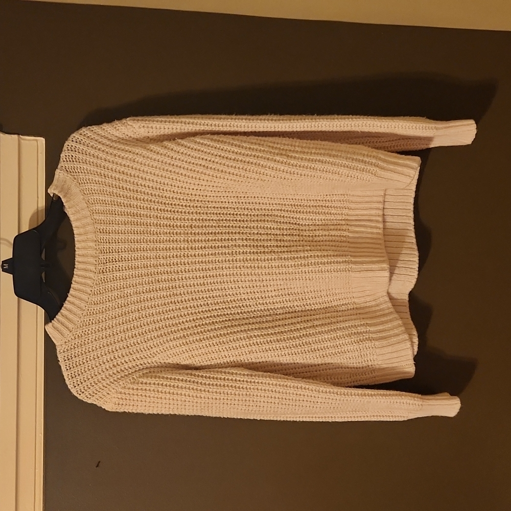 Is oversized white sweater